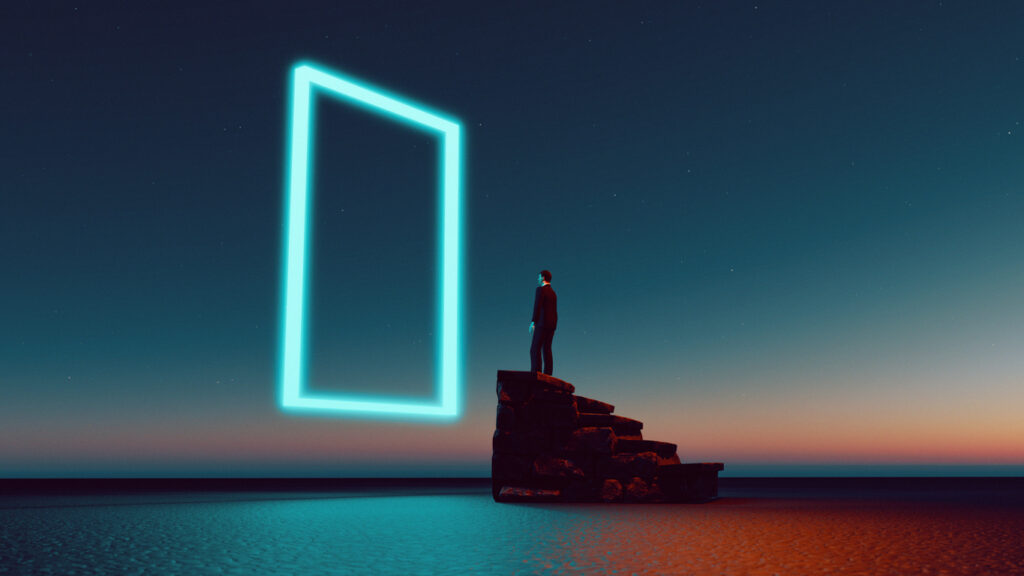 Man looking at a neon square on a rock in the sea