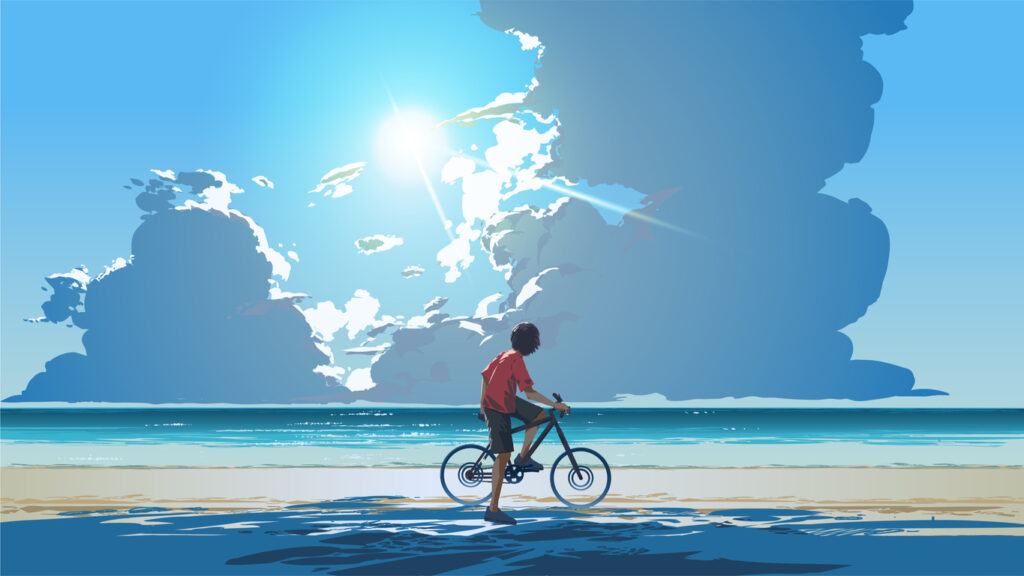 Man riding bike across a beach wellbeing at work