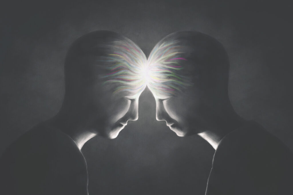 Two people pressed together connected with light in their heads