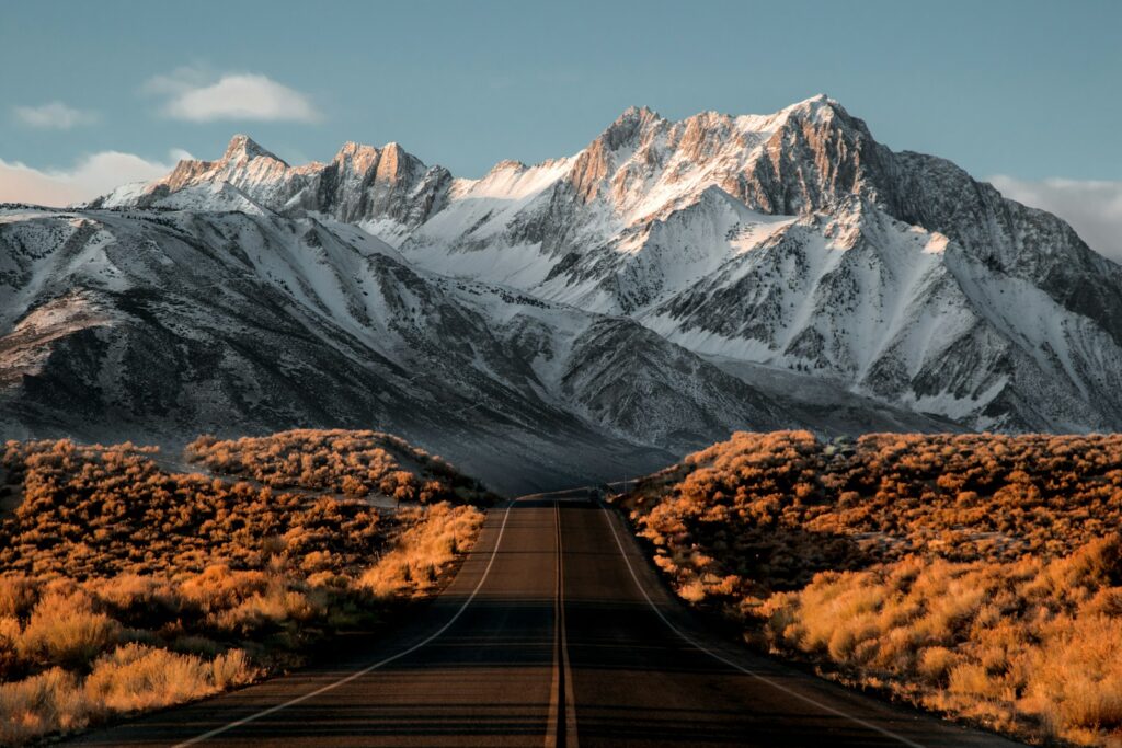 Remote setting. a road with a mountain in the background