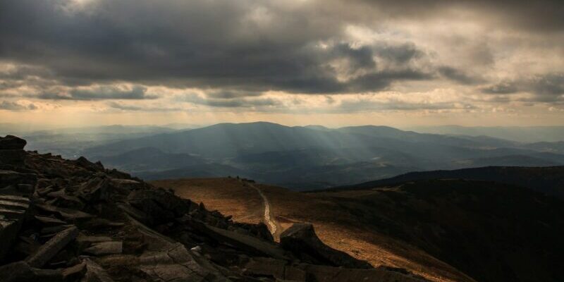 landscape photography of brown mountain representing opacity when it comes to the gender pay disparity