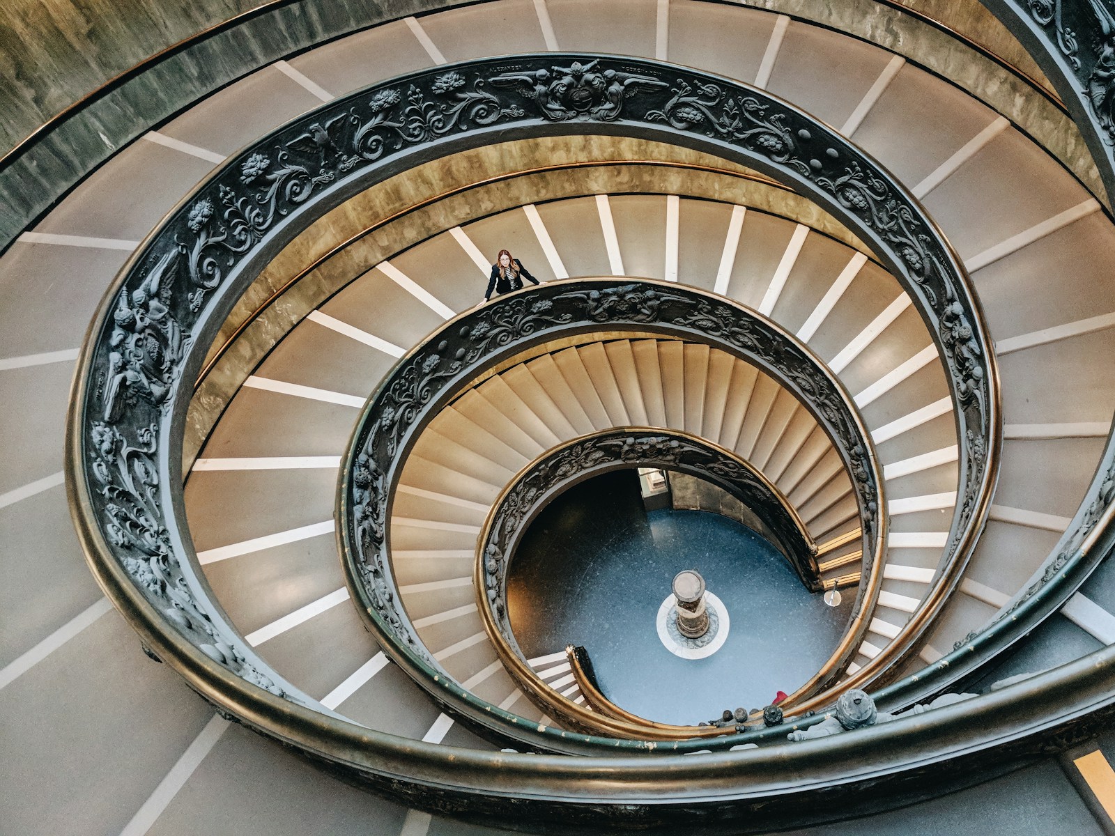 brown spiral staircase with brown wooden railings: Career ladder