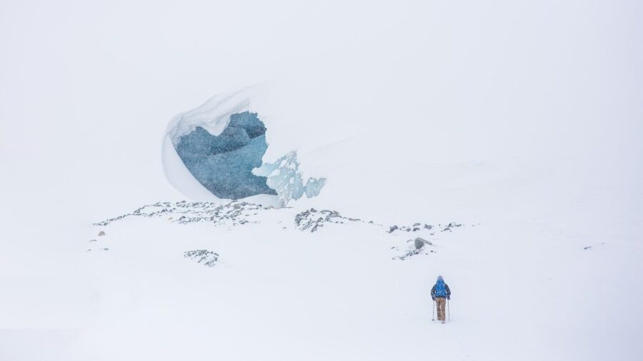 man skiing on mountain top: change work