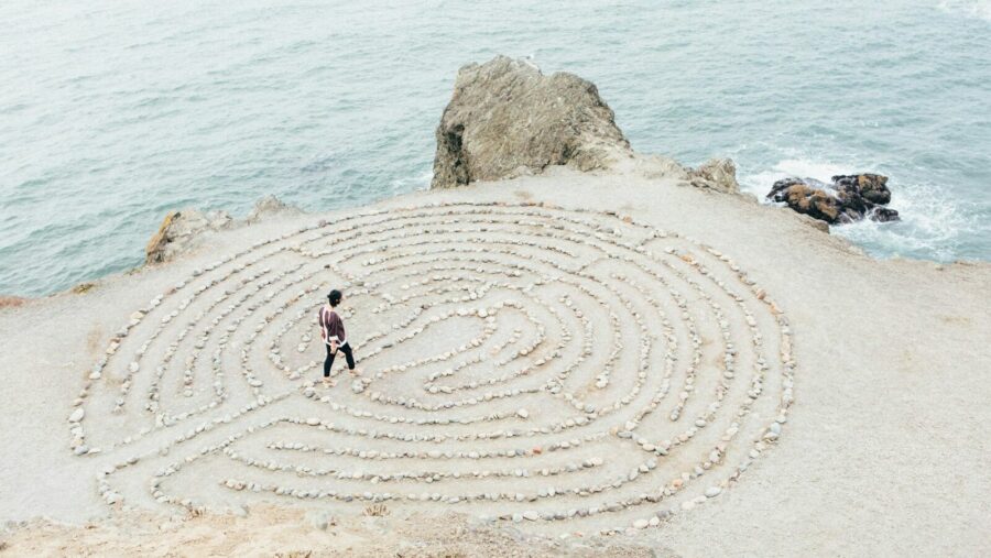 person walking on beach during daytime, habits and rituals