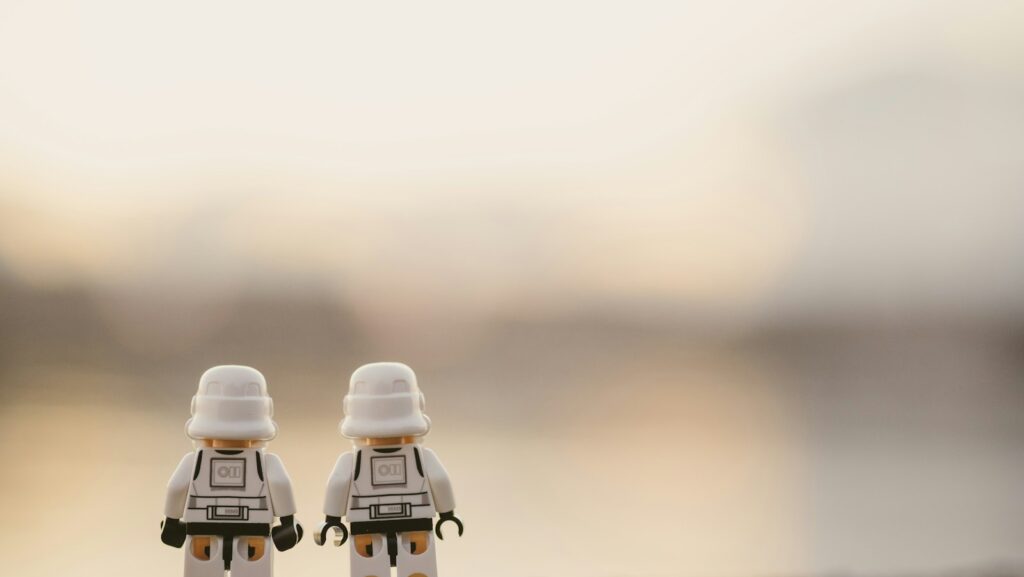 selective focus photography of two white Lego minifigures