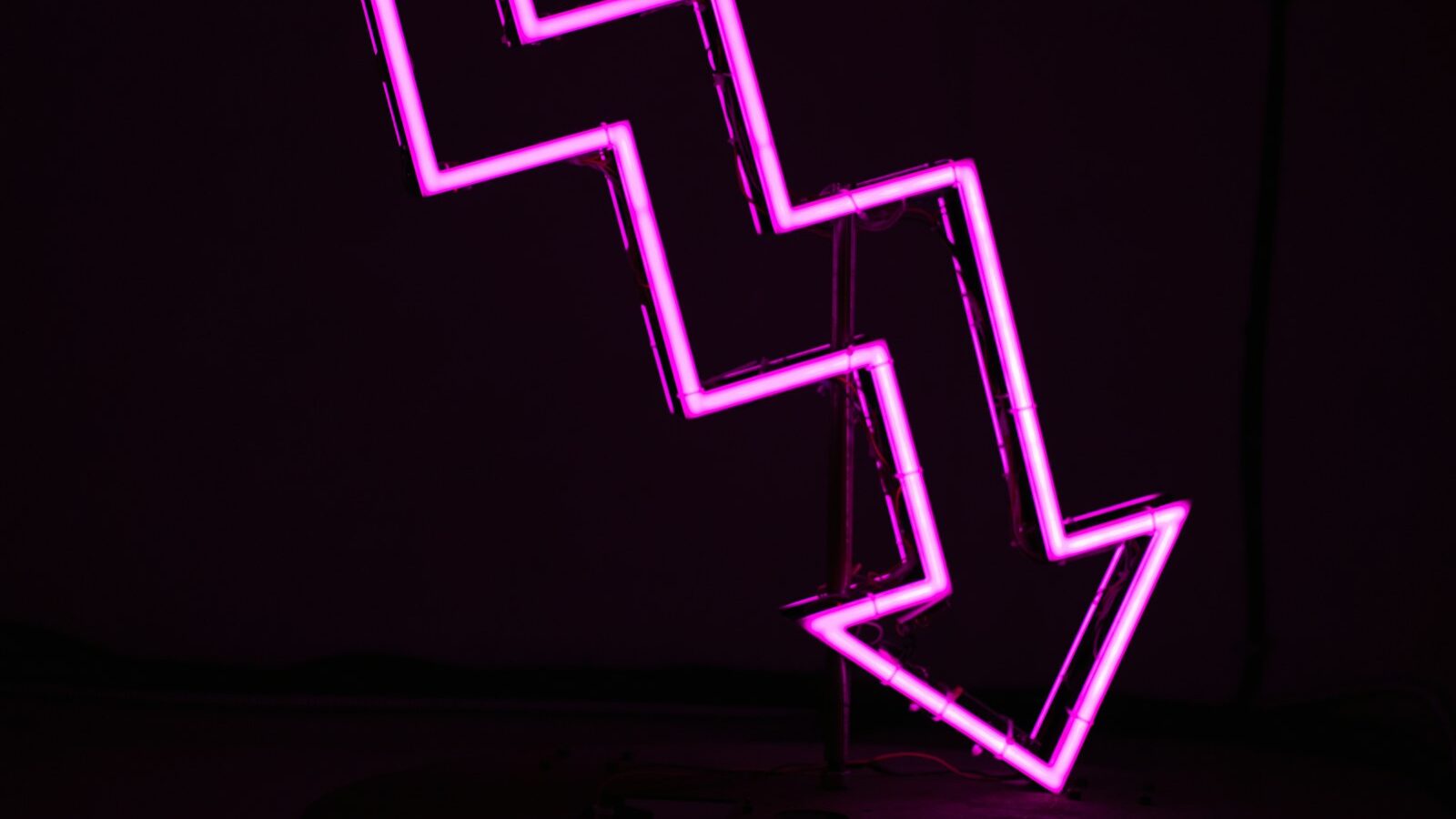 pink arrow neon sign, underperformance