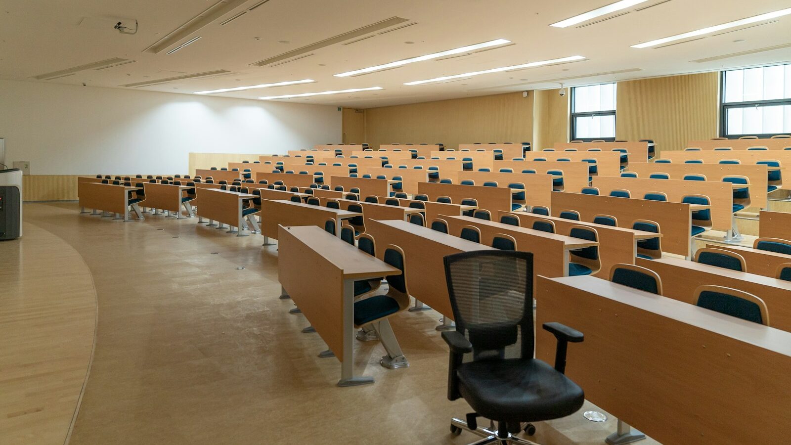 Redundancies in the Higher Education sector, black swivel chair beside rectangular brown wooden desk