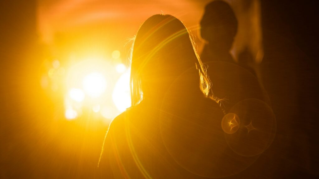 silhouette photography of woman in front of orange light, Gen Z myths