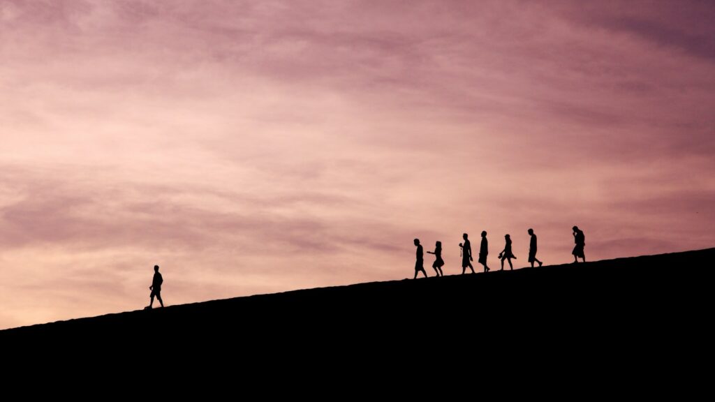 silhouette of people on hill, depicting authentic leadership