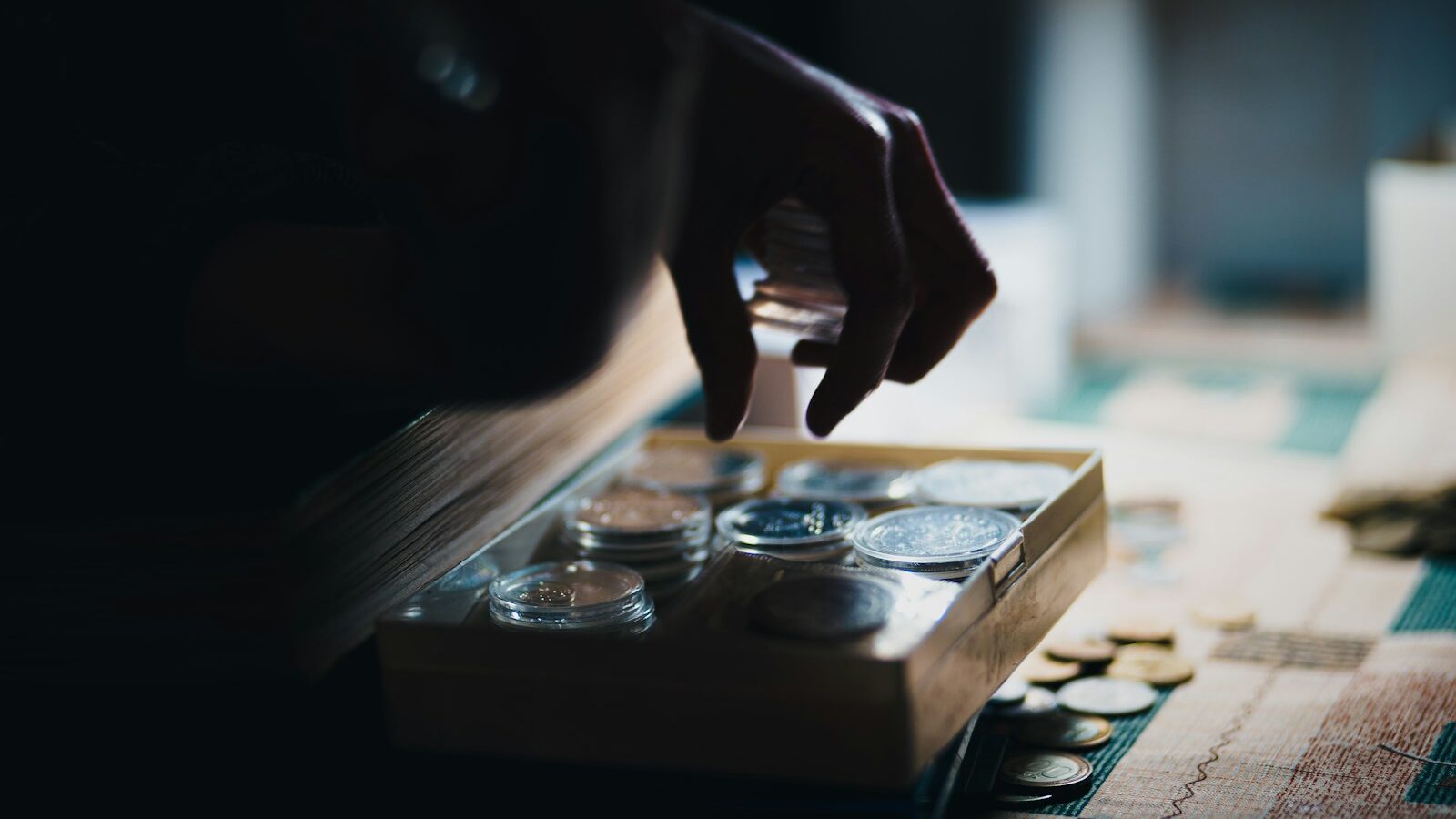 A person counting pennies, depicting financial stress