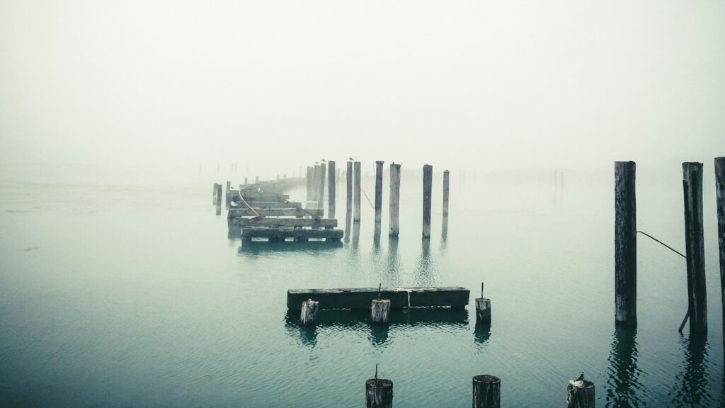 Broken wooden bridge representing lack of trust in performance management