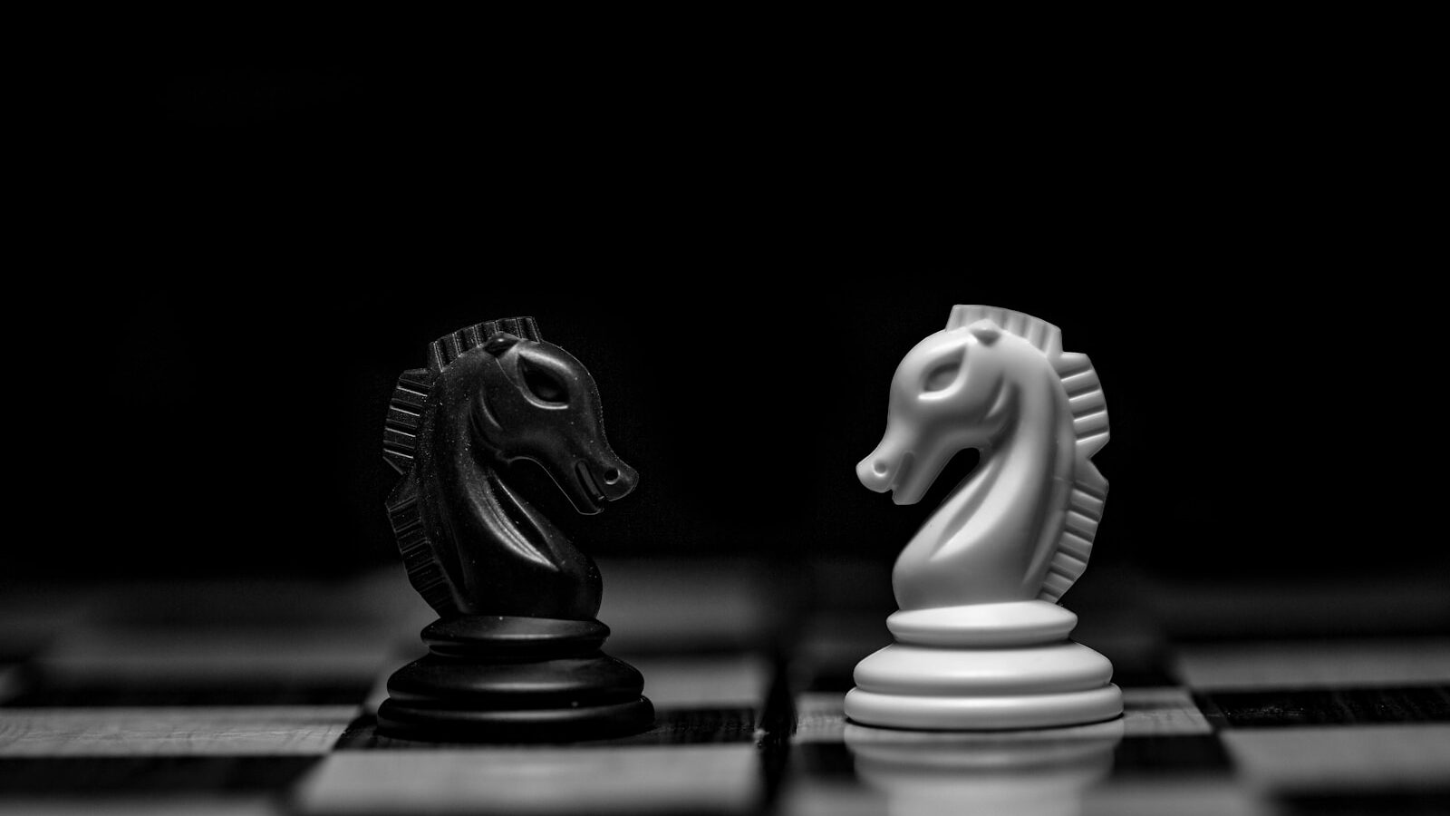 white ceramic figurine on black table.