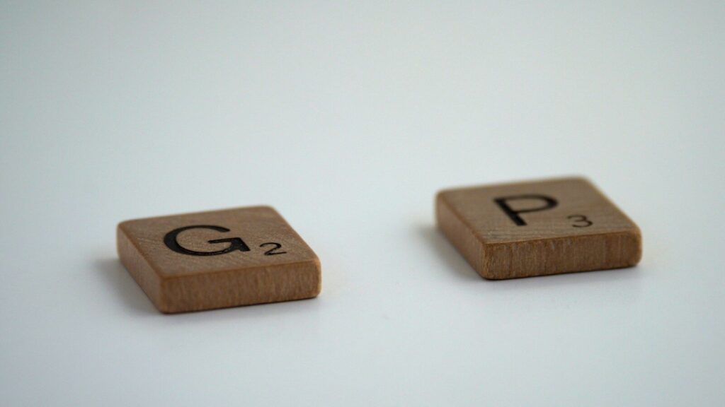 brown wooden dice on white surface